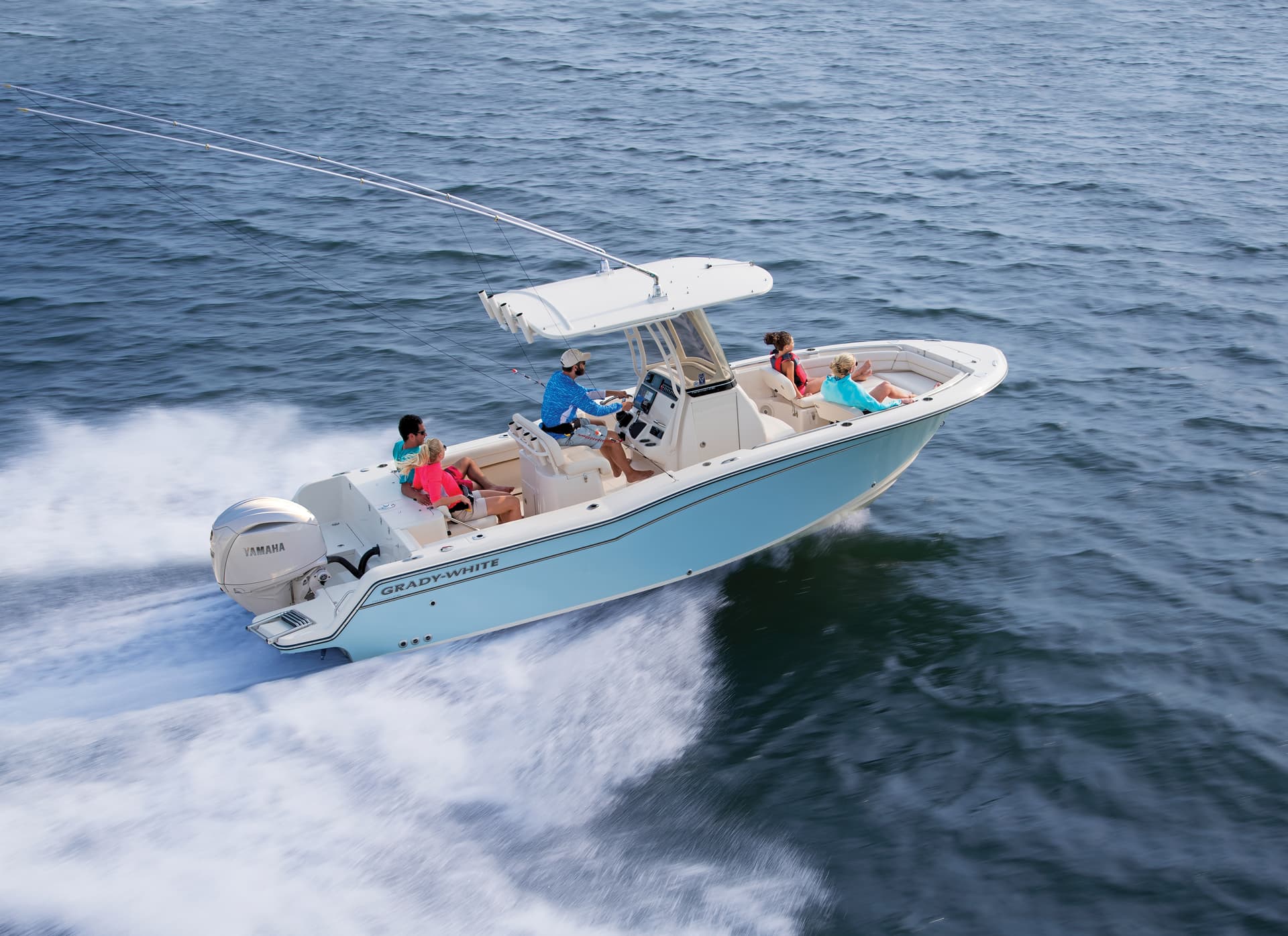 Grady-White Fisherman 236 running with a family aboard and rods in the rocket launcher