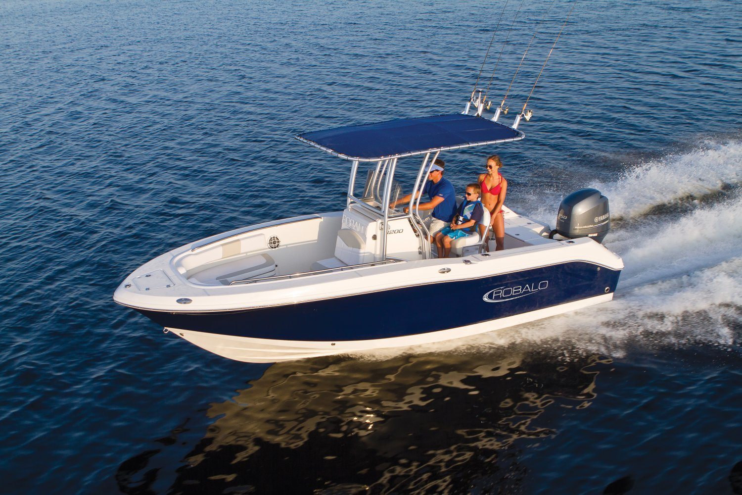 Image FAQ About Robalo Boats and the Robalo R200 a couple and their child on a Robalo R200